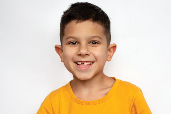 Smiling dark haired little boy