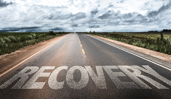 Road with the word Recovery painted on it