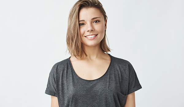 Blonde teenage female smiling