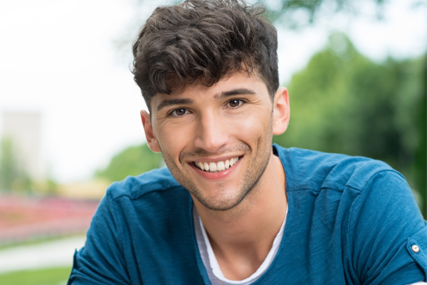 Smiling dark haired male teenager